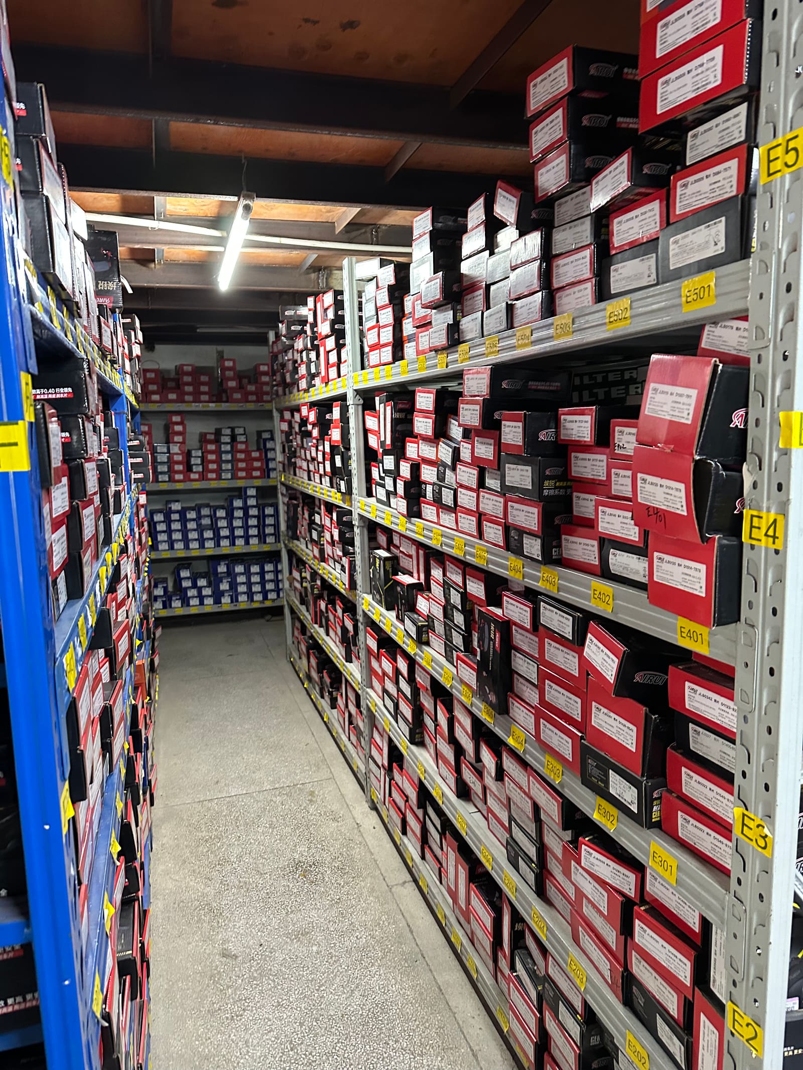 Warehouse shelving and boxed vehicle parts